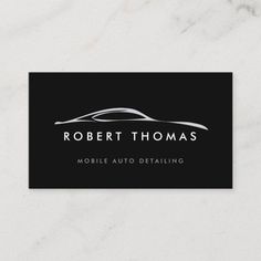 a black and white business card with a car logo on the front, which reads robert thomas