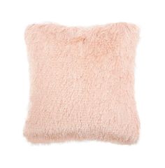 a light pink pillow with fluffy fur on the front and back of it, against a white background