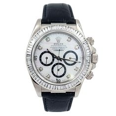 Men's Rolex Daytona 40mm Leather Band Watch with Mother of Pearl Diamond Dial and Diamond Bezel. Pre-Owned Year: 2005. Brand: Rolex. Gender: Men's. Bezel: Diamond. Type: Wristwatch. Case Size: 40mm. Condition: Excellent. Model Name: Daytona. Model Number: 116518. Band/Strap: Leather Band. Case Material: White Gold. Dial Color: Mother of Pearl. Hour Marks: Diamond Indexes. Water Resistance: 100m (10 ATM). Movement: Mechanical (Automatic). Certificate Detail: Rolex Card or Paper. Box / Certificate