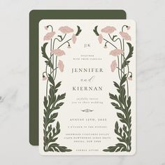 a wedding card with pink flowers and green leaves on the bottom, in front of a marble