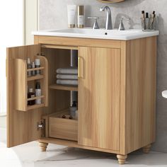 a bathroom with a sink and wooden cabinet