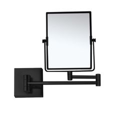 a square mirror mounted to the side of a wall next to a black towel rack