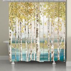 a shower curtain with trees and water in the background