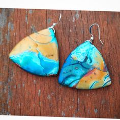 "Modern polymer clay pendant earrings  in blue and bronze shades. I got inspired by the synergy between heaven and earth to make this pendant. This unique polymer clay earrings are part of my 'Colors : Turquoise' collection, created using Mokume Gane polymer clay technique. The Width of choker is 1.5\" (3.5 cm)  The  length of pendant is 1.5\" ( 3.5 cm) You are invited to explore more art jewelry necklaces at my shop: https://www.etsy.com/il-en/shop/GlArtJewelry?ref=hdr_shop_menu&section_id=1925 Handmade Turquoise Resin Earrings, Handmade Artsy Clay Earrings, Handmade Artsy Resin Earrings, Artsy Polymer Clay Drop Earrings, Blue Polymer Clay Dangle Jewelry, Artsy Polymer Clay Dangle Jewelry, Artistic Hand Painted Polymer Clay Earrings, Multicolor Clay Dangle Jewelry, Turquoise Polymer Clay Drop Earrings