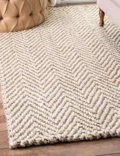 a white rug on the floor in a living room