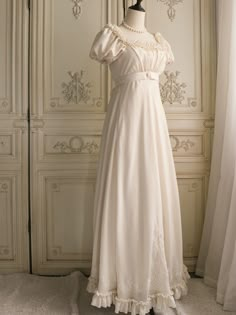 Immerse yourself in the elegance of the Regency era with this exquisite cream Bridgerton-inspired dress. Perfect for brides and special occasions, this gown combines vintage charm with luxurious details, making it a timeless addition to your wardrobe. Elegant Design: Featuring a classic Regency silhouette, this dress boasts puffed sleeves and a gracefully flowing skirt. The delicate chiffon ruffles and floral appliqués add a touch of romantic charm, while the beaded embellishments enhance its so Regency Era Nightgown, Regency Nightgown, Regency Silhouette, Regency Era Dress, Regency Dresses, Nontraditional Wedding Dress, Wedding Dresses High Low, Floral Applique Dress, Champagne Evening Dress