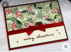 a close up of a christmas card with a bow on the front and bottom corner