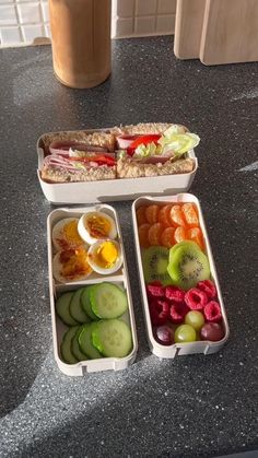 three containers with different types of food in them