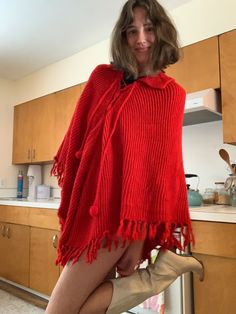 Poncho is a one size fits all size. Red One-size Poncho Cape, Red One-size Cape Poncho, Red One Size Cape Poncho, Red Long Sleeve Poncho, One Size, One-size Knit Winter Cape, Winter Knit Cape One Size, Red Winter Cape One Size, Casual Red Long Sleeve Poncho, Red Oversized Poncho For Winter