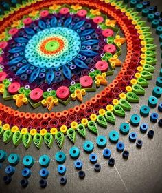 a colorful circular design made out of plastic beads