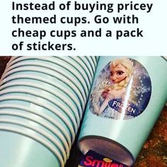 there is a cup with some stickers on it next to a stack of cups