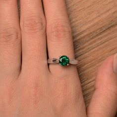 It is a lab emerald ring. The main stone is 7mm*7mm round cut, weight about 1.3 carats. The basic metal is sterling silver and plated with rhodium. To change the metal to a solid gold (white/rose) or platinum is also available, please ask for a quotation if you want. You can also go to my shop Home for more elegant rings: https://www.etsy.com/shop/godjewelry?ref=hdr_shop_menu More emerald rings: https://www.etsy.com/shop/godjewelry?ref=seller-platform-mcnav&section_id=20709240 Customization Samantha Smith, Elegant Rings, Green Gemstone Ring, Emerald Rings, May Birthstone, Elegant Ring, Green Gemstones, 3 Carat, Anniversary Ring