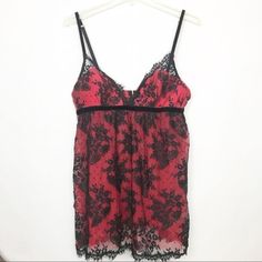 Victoria’s Secret Very Sexy Red Lace Babydoll. Size Medium. Nwot. Red And Black Lace Floral Red Tulle With Delicate Black Lace Very Lightly Padded Bust With No Wire Bra Like Closure Keyhole Back Adjustable Straps Babydoll Fit 100% Polyester. Excellent Condition No Known Defects O Flaws. Bust - 34 Inches. Underarm To Hem -18 Inches. All Measurements Are Approximate. Please See Photos For More Details. 0601s Red Party Sleepwear With Built-in Bra, Red Coquette Sleepwear For Party, Flirty Lace Sleepwear For Party, Red Sleeveless Party Sleepwear, Red Camisole For Party, Victoria's Secret Camisole For Party, Red Lace Sleeveless Sleepwear, Red Sleeveless Lace Sleepwear, Red Lace Coquette Sleepwear