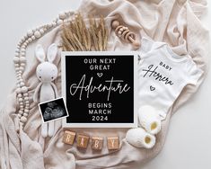 a baby announcement is displayed on a blanket