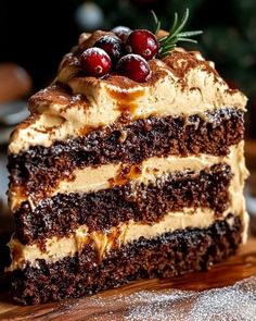 a piece of cake with frosting and cherries on top