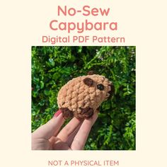 a hand holding a small crocheted stuffed animal in front of green bushes with the text, no sew capybara digital pd pattern not a physical item