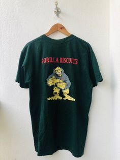 Vintage Gorilla Biscuits " Hold Your Ground" New York City Hardcore Punk Band Revelation Records T-S Green Punk Style T-shirt For Streetwear, Green Band Merch T-shirt With Front Print, Green Band Merch T-shirt For Streetwear, Green Short Sleeve Punk T-shirt, Band Merch Graphic T-shirt For Skateboarding, Green Punk Crew Neck T-shirt, Green Punk Style Crew Neck T-shirt, Screen Print Band Merch Tops For Skateboarding, Band Merch Graphic Print Tops For Skateboarding