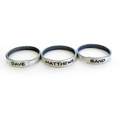 Simple little engraved rings handcrafted from sterling silver. Customize your rings to reflect what is important to you. Perhaps your children's names, an anniversary date or bible verse. We have given the band a rustic feel with darkened edges and a brushed finish. They will arrive ready to present as a gift. Band: 2mm wide, 1mm thick Made to order. Allow up to 14 business days for fabrication before shipment. There is a charge for the re-sizing of rings, please make sure of your proper ring si Adjustable Customizable Engraved Sterling Silver Ring, Customizable Adjustable Sterling Silver Engraved Ring, Adjustable Personalized Stackable Rings, Adjustable Stackable Promise Rings With Custom Name, Customizable Adjustable Silver Engraved Ring, Adjustable Engraved Promise Bands, Adjustable Personalized Silver Stackable Rings, Adjustable Stamped Stackable Rings For Everyday, Adjustable Stamped Engraved Ring With Round Band