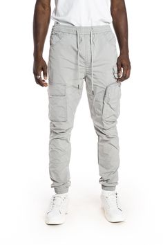 - Slim jogger fit- 100% Polyester- Light Grey- Non-stretchy woven fabric- Metal string tip- Cargo pockets with hidden snap- 3D zipper pocket- Waist size adjustable with elastic band and string New York Streetwear, Slim Joggers, Nylon Pants, Mens Big And Tall, Big And Tall, Waist Size, Color Light, Cargo Shorts, Elastic Band