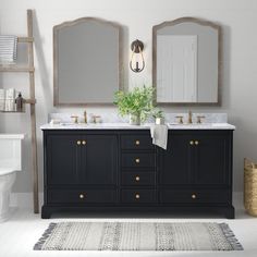 a bathroom with two sinks and mirrors on the wall next to a rug in front of it