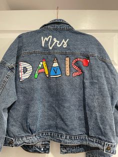 a denim jacket with the words paris written on it