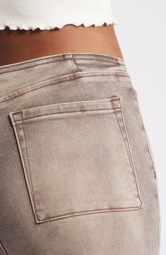 These faded jeans add leg-lengthening style to everyday looks with raised front pintucks and a low rise that updates a '70s-inspired flare. 33 1/2" inseam; 22" leg opening; 9 1/2" front rise; 15 1/2" back rise (size 29) Zip fly with button closure 66% cotton, 29% polyester, 3% viscose, 2% spandex Machine wash, tumble dry Imported Classic Mid-rise Faded Flare Jeans, Classic Faded Mid-rise Flare Jeans, Stretch Distressed Faded Bottoms, Faded Cropped Leg Flare Jeans For Fall, Fitted High Waist Faded Bottoms, Fitted Distressed Faded Bottoms, Fitted Washed Bottoms With Standard Cut Leg, Faded Stretch Mid-rise Bottoms, Faded Bottoms With Standard Cut Leg For Spring