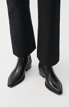 Hidden goring insets bring modern intrigue to a leather Chelsea boot balanced by a pointy toe and chunky block heel. 1 1/2" heel 6 1/2" shaft Pull-on style with elastic gore insets Leather upper and lining/synthetic sole Imported Black Point Boots, Black Boots Low Heel, Styling Western Boots, Photographer Attire, Harry Styles Chelsea Boots, Pointy Boots Outfit, Steel Toed Boots, Pointed Chelsea Boots, Fish Shoes