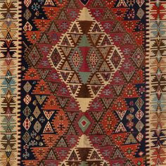 an old rug with many different colors and patterns