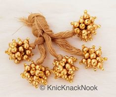 This listing is for Beautiful and one of a kind Gold Bead Tassels Latkan, Indian Latkans, Gold Beaded Danglers, Sewing Latkans, Beaded Tassels. Handmade Measurements: Approx. 3 cm This stunner can be used for any of the following:  *Dress Design: Wedding Dresses, Festive Wear, Ethnic wear *Saree Embellishments, Blouse Embellishments, Salwar Kameez Embellishments *Tops, Dress *Home Decor *Pillow Covers, Cushion Covers, Ottoman decoration *Bag Embellishments *Jewellery making,  *Scarves, Stoles *C Cheap Gold Chandbalis With Latkans, Rideaux Boho, Bead Tassels, Tassels Handmade, Beading Netting, Bead Embroidery Patterns, Embellished Blouse, Types Of Embroidery, Festive Wear