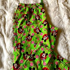 Disney’s Mickey Mouse Pajama Pants With Candy Canes Never Worn But Taken Off The Tags. In Perfect Condition And Super Cute For The Holidays. Disney Christmas Pajamas, Green Long Pants For Bedtime, Casual Minnie Mouse Sleepwear For Pajama Party, Disney Cotton Pants For Loungewear, Cotton Minnie Mouse Sleepwear For Pajama Party, Casual Mickey Mouse Bottoms For Loungewear, Mickey Mouse Pj Pants, Minnie Mouse Cotton Sleepwear For Pajama Party, Cute Disney Pajama Pants