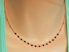 delicate rose gold choker necklace gold chain necklace dainty gold choker gold chain choker black necklace spinel rosary satellite necklace This is a gorgeous necklace that can be worn everyday or on special occasions! This necklace has two parts: the satellite chain necklace part and the black spinel rosary bar /part. This chain rosary necklace is available in gold and rose gold finish! Black spinel stones are tiny and faceted which give a sparkling touch to your look! A beautiful satellite and Dainty Double Strand Rose Gold Jewelry, Rose Gold Double Strand Jewelry With Delicate Chain, Dainty Rose Gold Jewelry With Beaded Chain, Dainty Rose Gold Jewelry With Tiny Beads, Rose Gold Jewelry With Tiny Beads For Gift, Elegant Rose Gold Jewelry With Satellite Chain, Satellite Chain Choker As Gift, Elegant Black Jewelry With Satellite Chain, Elegant Tiny Beads Choker Jewelry