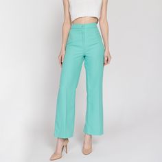 Vintage 70s aqua blue trousers with a high waist and a straight leg. Measurements and Condition:    Fits like: Labeled size 10 petite, fits modern women's extra small regular Fabric: Polyester Brand: Stockton of Dallas Condition: Excellent   Waist: 24" Hips: 36" to 38" - taken at the bottom of the zipper opening Rise: 12.25" Inseam: 29" Shown on a 5'9" model with measurements of 33"-24"-37", usually wears size XS to small. See our FAQ for more info on sizing and condition ratings. Polyester Pants, Blue Trousers, High Waisted Trousers, Aqua Blue, Vintage 70s, Modern Woman, Dallas, Capri Pants, Straight Leg