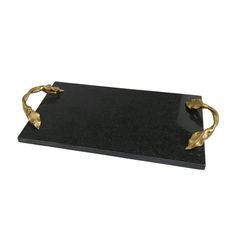 a black and gold tray with two golden leaves on the handles, one is holding an empty