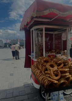 a street vendor selling bread and pretzels