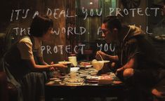 a man and woman sitting at a table with coffee cups in front of them that says it's not ideal you protect the world as well protect you