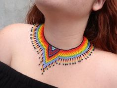 This choker is a unique piece made entirely by hand by Huichol artisans, very colorful boho style, to wear on any occasion. The Huichol artisans base all their works and their designs on visions they have during their sacred rituals proper to their ethnicity, The Huicholes inhabit the states of Nayarit, Jalisco, Zacatecas and Durango. Piece made by artisans nayaritas. Sent anywhere in the world from Tepic, Nayarit. Colorful Beaded Choker For Festivals, Colorful Beaded Choker Necklace For Festival, Bohemian Rainbow Choker As Gift, Bohemian Rainbow Choker As A Gift, Handmade Rainbow Beaded Choker Necklaces, Handmade Rainbow Choker Beaded Necklaces, Handmade Rainbow Beaded Choker Necklace, Handmade Rainbow Choker For Festivals, Handmade Rainbow Choker For Festival