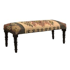 an upholstered bench with wooden legs and a floral design on the backrest