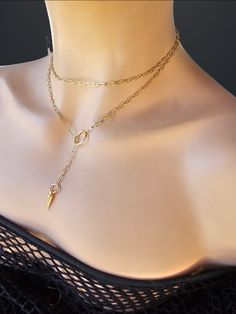 This is a dainty minimalist 24k Gold Filled steel Lariat Necklace Set wrap gothic grunge punk aesthetic choker with Spike pendant.  The minimalist design gives it a trendy and stylish feel, while it has a touch of gothic Punk edge.   This necklace is versatile and can be worn long or doubled up for a layered look. This is a dainty chain, but is strong steel. if you are looking for someone more suitable to "fun and games" please take a look in my shop for more sturdy versions 😉 Approximately 35" end to end Trendy Lariat Jewelry For Everyday, Minimalist Metal Jewelry With Paperclip Chain, Gift Lariat Chain Necklace Tarnish Resistant, Minimalist Metal Paperclip Chain Jewelry, Handmade Everyday Jewelry Choker, Minimalist Choker Chain Necklace As Gift, Minimalist Chain Choker Necklace For Gift, Lariat Charm Necklaces With Lobster Clasp As A Gift, Minimalist Chain Choker Necklace Gift