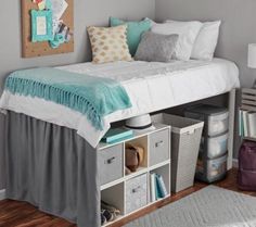 a bedroom with a bed and storage drawers