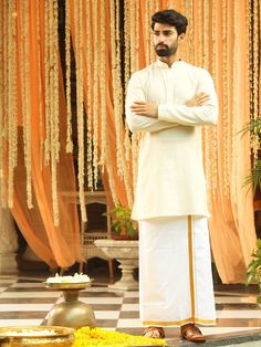 Vastramay Men Cream Pure Cotton Kurta with Mundu Bollywood Style Cotton Traditional Wear With Naqshi, Cotton Kurta For Traditional Ceremonies With Traditional Drape, Straight Kurta For Diwali Rituals, Cotton Sherwani For Traditional Ceremonies And Festivals, Cotton Kurta With Traditional Patterns And Drape, Cotton Kurta With Traditional Patterns, Cotton Sherwani With Traditional Patterns, Traditional Kurta For Puja With Traditional Fit, Cream Cotton Salwar Kameez With Dabka