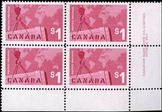 four stamps with the words canada on them and a world map in pink, black and white