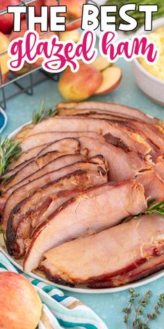 the best glazed ham recipe on a platter with apples in the background and text overlay that reads, the best glazed ham