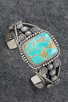 This beautiful and substantial Royston turquoise and sterling silver bracelet was made by Navajo silversmith Michael Calladitto. The back is signed M&R Calladitto, Navajo and stamped .925.Size: 5 1/2" (will fit up to a 6 7/8" wrist)Gap: 1 3/8"Width: 1 1/2"Free shipping on all orders! We ship with USPS and always include tracking. All orders ship within a day of payment.Returns are accepted up to 30 days after you receive your order. Just send us a message. Our shop offers cash back or store cred Royston Turquoise, M R, Spring Sale, Sterling Silver Bracelet, Turquoise Sterling Silver, Sterling Silver Bracelets, Silver Bracelet, Gap, Turquoise