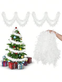 a christmas tree surrounded by white feathers and presents