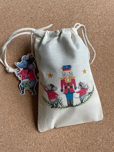 a small bag that has some decorations on it