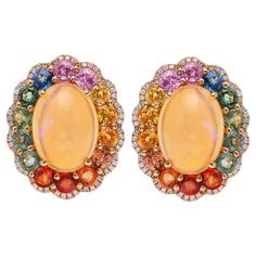 18K Yellow Gold Ethiopian Opal: 7.78 carats Multi-Colored Sapphires: 5.49 Diamond: 0.407 carats Length: .75'' Omega Backs Closure Sapphire And Diamond Earrings, Multi Sapphire, Sapphire Diamond, Gold Studs, Brilliant Cut Diamond, Diamond Studs, Ethiopian Opal, Or Rose, Fashion Art