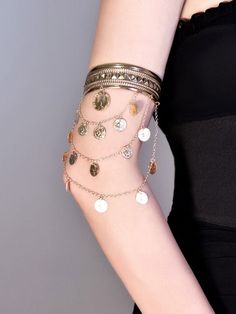 Elevate your cyberpunk style with our silver/gold chains arm cuff. This statement piece features intricate chain detailing, adding an edgy and futuristic touch to your look. Available in both silver and gold finishes, this arm cuff is perfect for adding a bold accent to any outfit. Embrace the cyberpunk aesthetic and stand out from the crowd with this eye-catching arm cuff.   Please note that this product includes only one arm cuff. Gold Cyberpunk, Fairy Arm Cuff, Siren Halloween, Siren Outfit, Gold Arm Cuff, Jewelry Portfolio, Jewelry Mood Board, Arm Accessories, Band Outfits