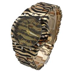 This Womens Animal Print Metal Watch from Olivia Pratt is super trendy, featuring a durable materials band and face, this watch is the perfect addition to your accessory collection. Olivia Pratt is always looking after new designs to improve your style! Using the best quality materials available in all of our products to ensure long durability in your every day wear. Please be aware, color vibrancy of the product might change from device to device. If you have questions we're here to help! Trendy Metal Analog Watches, Trendy Gold Watches With Metal Dial, Trendy Gold Metal Watch Accessories, Trendy Gold Stainless Steel Watches, Trendy Gold Metal Watches, Improve Your Style, Gold Tiger, Metal Watch, New Designs