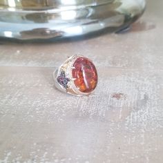 This Is A Beautiful Vintage Piece...And In Like New Condition. Eye Catching Large Synthetic Orange Sapphire, Gold Wash Trimmings Over .925 Sterling Accented With Ruby Stones. Size 8 Vintage Orange Gemstone Jewelry, Orange Gemstone Vintage Necklace, Orange Oval Antique Jewelry, Orange Sapphire Ring, Orange Gemstone Ring In Sterling Silver, Vintage Orange Cabochon Rings, Orange Sapphire, Ruby Stone, Gold Wash