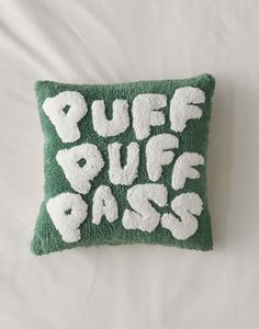 a green and white pillow with the words puff puff bass on it's side